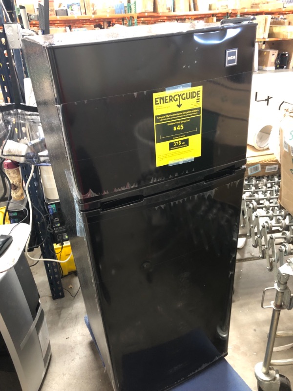 Photo 2 of *SEE last pictures for damage* 
RCA RFR741-BLACK Apartment Size Large Compact Refrigerator, 7.5, Black
