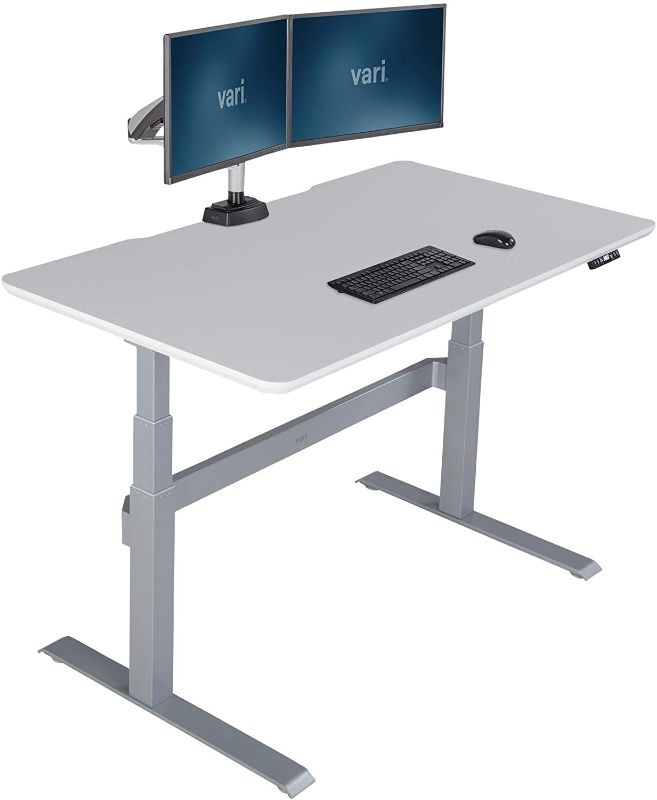 Photo 1 of Vari Electric Standing Desk 60" x 30" - Height Adjustable Sit to Stand Desk - Solid-Top Desktop with Included Crossbar and Cable Management Tray (White)
