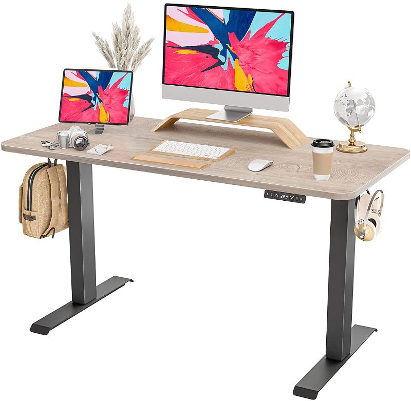 Photo 1 of FAMISKY Dual Motor Adjustable Height Electric Standing Desk, 48 x 24 Inches Stand Up Home Office Desk with Splice Tabletop, Black Frame/Greige Top
