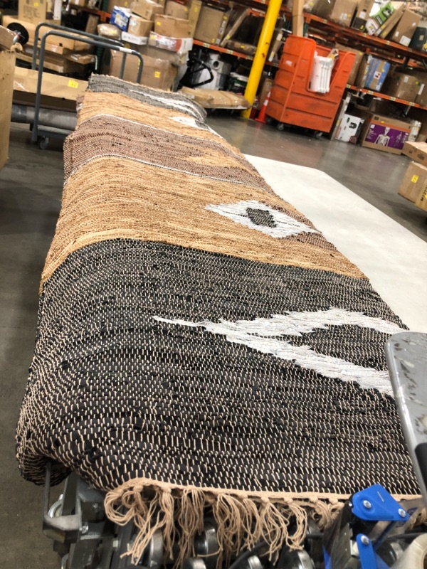 Photo 1 of 11.5ft brown Aztec Area Rug