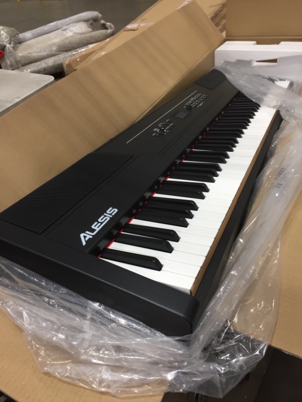 Photo 2 of Alesis Recital Pro - 88 Key Digital Piano Keyboard with Hammer Action Weighted Keys, 2x20W Speakers, 12 Voices, Record and Lesson Mode, FX and Display
