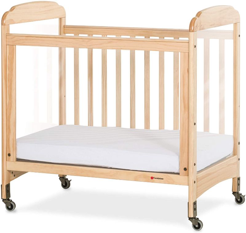 Photo 1 of Foundations Serenity 3-Panel Clearview Compact Crib, Fixed-Side, Natural Wood
