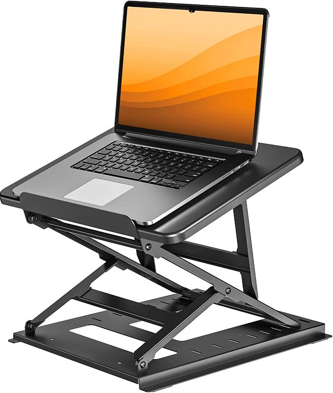 Photo 1 of HUANUO Adjustable Laptop Stand for Desk - Easy to Sit or Stand with 9 Adjustable Angles, Laptop Riser Reduces Neck Pain, Fits 15.6 Inch Laptop & Notebook, Height Adjustable Computer & Tablet Riser
