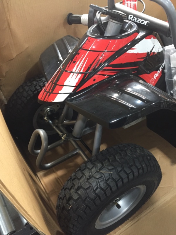 Photo 2 of Razor Dirt Quad - 24V Electric 4-Wheeler ATV - Twist-Grip Variable-Speed Acceleration Control, Hand-Operated Disc Brake, 12" Knobby Air-Filled Tires