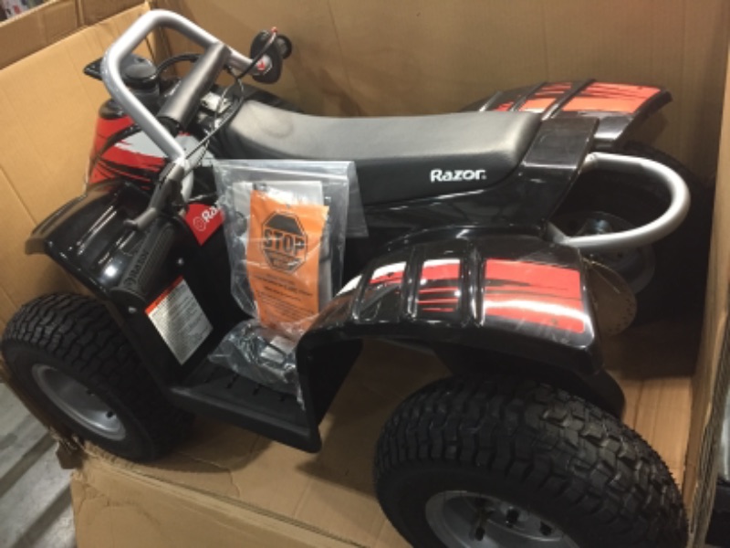 Photo 3 of Razor Dirt Quad - 24V Electric 4-Wheeler ATV - Twist-Grip Variable-Speed Acceleration Control, Hand-Operated Disc Brake, 12" Knobby Air-Filled Tires