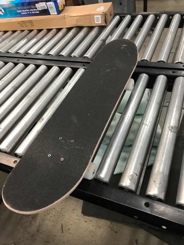 Photo 1 of Black skateboard