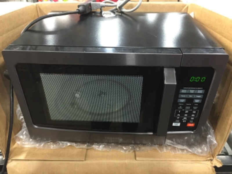 Photo 4 of *Not functional*
Toshiba em131a5c-bs microwave oven with smart sensor, easy clean interior, eco mode and sound on/off, 1.2 cu.ft, 1100w, black s