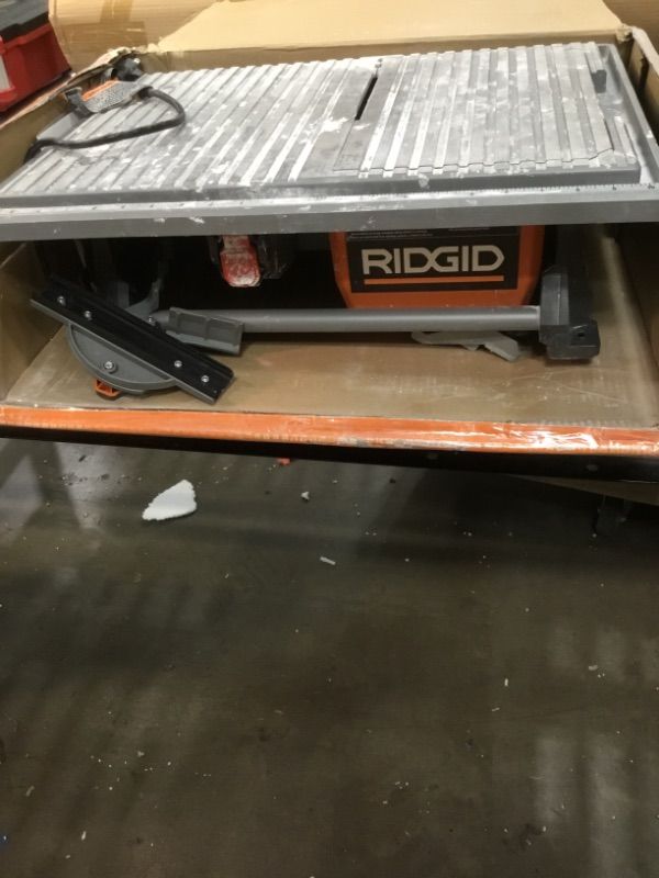 Photo 1 of Ridgid R4021 120-Volt 6.5 Amp Corded 7 Inch Self-Aligning Table Top Wet Tile Saw (New Open Box)