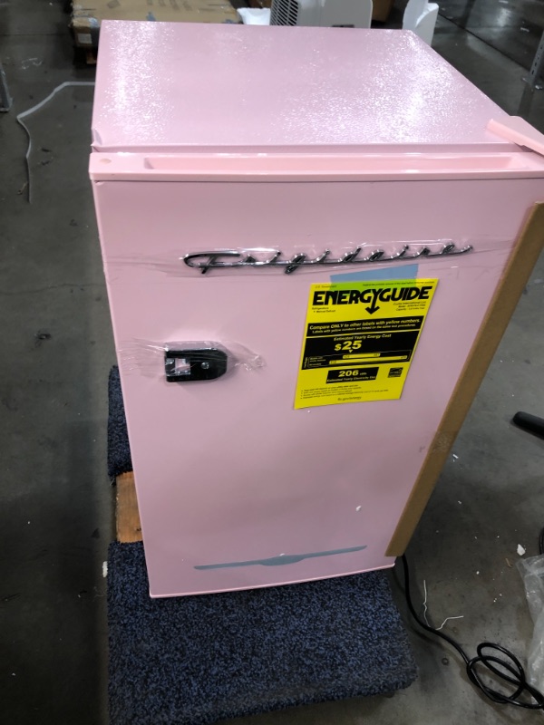 Photo 2 of FRIGIDAIRE EFR376 Retro Bar Fridge Refrigerator with Side Bottle Opener, 3.2 cu. Ft, Pink/Coral

WIRE CUT 
