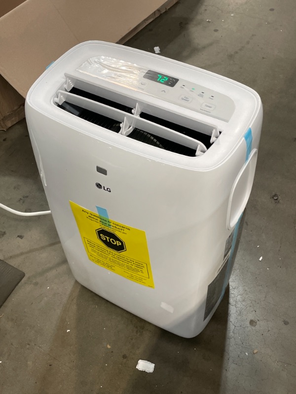 Photo 2 of ***PARTS ONLY*** LG 7,000 BTU (DOE) / 10,000 BTU (ASHRAE) Portable Air Conditioner, Cools 300 Sq.Ft. (12' x 25' room size), Quiet Operation, LCD Remote, Window Installation Kit Included, 115V 13.27 x 17.32 x 27.36 inches

