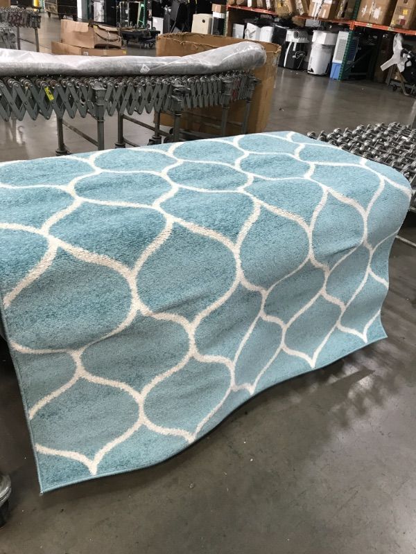 Photo 1 of 5ft x 8ft light blue circle design rug