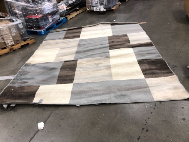 Photo 1 of 10ft x 8ft grey, brown and beige square design rug