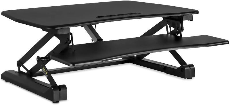 Photo 1 of Mount-It! Electric Standing Desk Converter | Motorized Sit Stand Desk with Built in USB Port | Ergonomic Height Adjustable Workstation | Black (MI-7927E)
