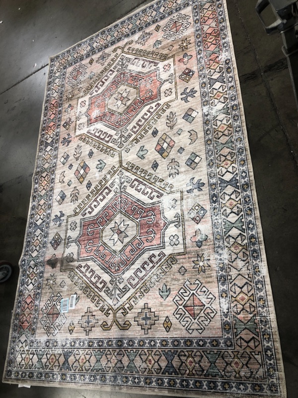 Photo 1 of 5 x 8 multi color and multi shape area rug