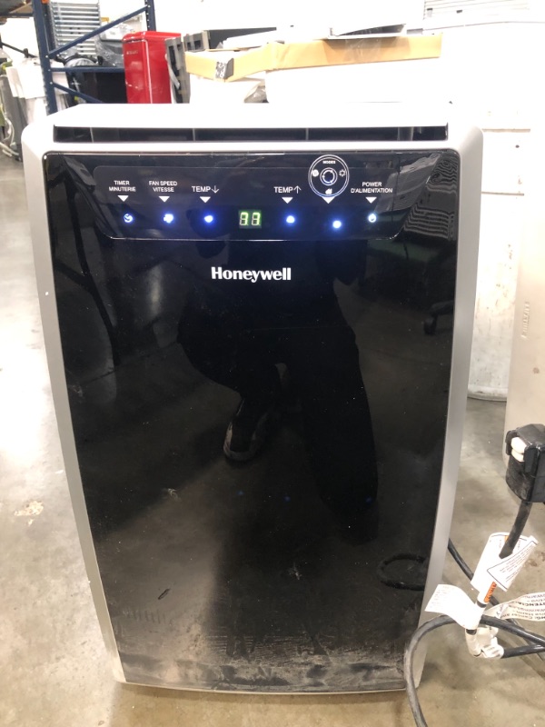 Photo 1 of Honeywell MN12CES Portable Air Conditioner, 12,000 BTU Cooling, With Dehumidifier & Fan (Black-Silver)