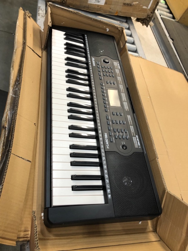 Photo 4 of Alesis Melody 54 - Electric Keyboard Digital Piano with 54 Keys, Speakers, 300 Sounds, 300 Rhythms, 40 Songs, Microphone and Piano Lessons
**NON FUNCTIONAL**