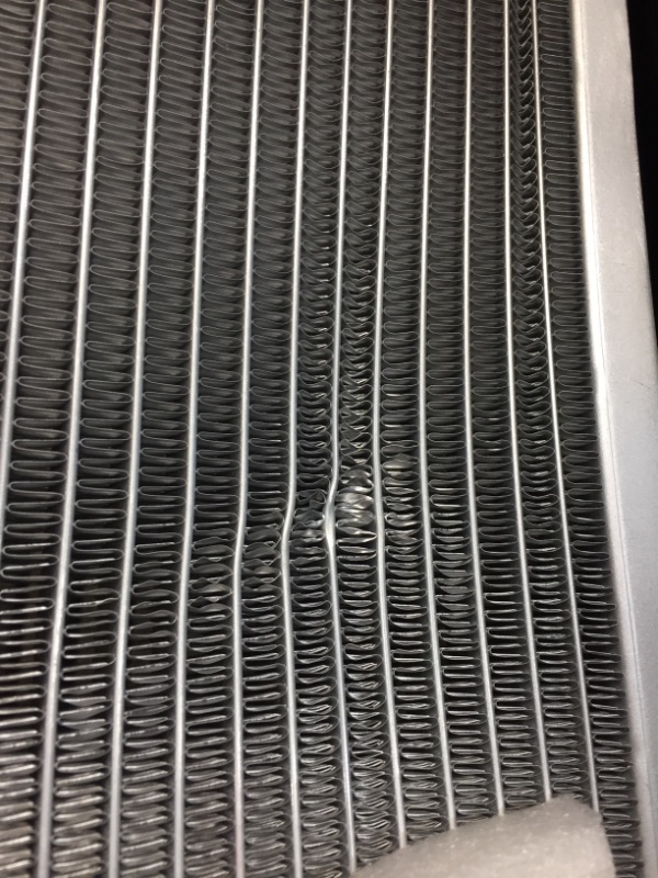 Photo 2 of mishimoto radiator UNKNOWN SIZE. SMALL DENT.