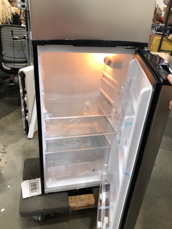 Photo 2 of RCA RFR725 EFR749 2 Door Apartment Size Refrigerator with Freezer, 7.5 cu. ft, Platinum, Stainless DAMAGE TO THE BOTTOM OF THE ITEM AND DOORS A SLIGHTLY BENT. COVER TO THE GASKET IS CRACKED ON TOP
