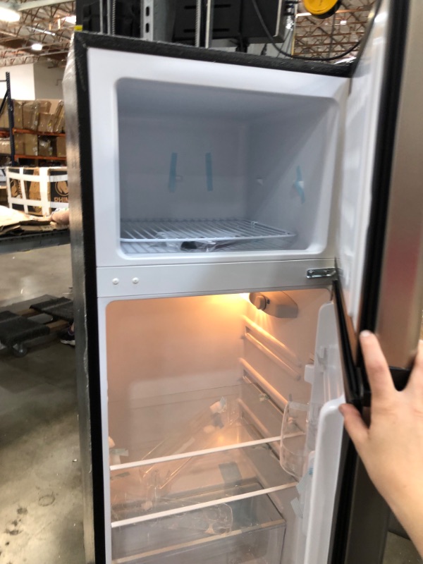 Photo 3 of RCA RFR725 EFR749 2 Door Apartment Size Refrigerator with Freezer, 7.5 cu. ft, Platinum, Stainless DAMAGE TO THE BOTTOM OF THE ITEM AND DOORS A SLIGHTLY BENT. COVER TO THE GASKET IS CRACKED ON TOP
