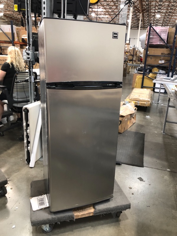 Photo 4 of RCA RFR725 EFR749 2 Door Apartment Size Refrigerator with Freezer, 7.5 cu. ft, Platinum, Stainless DAMAGE TO THE BOTTOM OF THE ITEM AND DOORS A SLIGHTLY BENT. COVER TO THE GASKET IS CRACKED ON TOP
