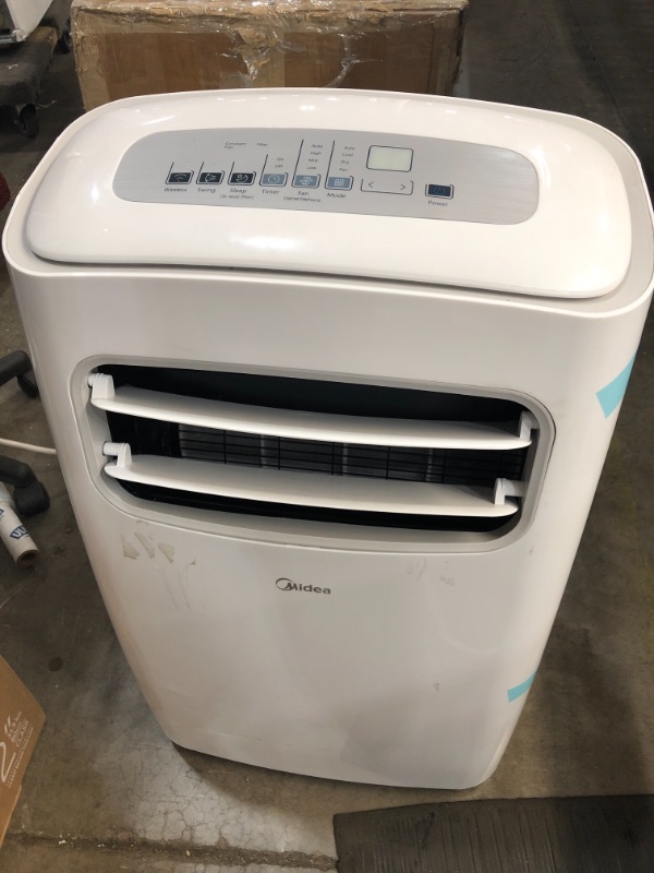 Photo 4 of **DAMAGED** MIDEA 3-in-1 Portable Air Conditioner, Dehumidifier, Fan, for Rooms up to 275 sq ft Enabled, 12,000 BTU DOE (6,500 BTU SACC) Control with Remote, Smartphone...
