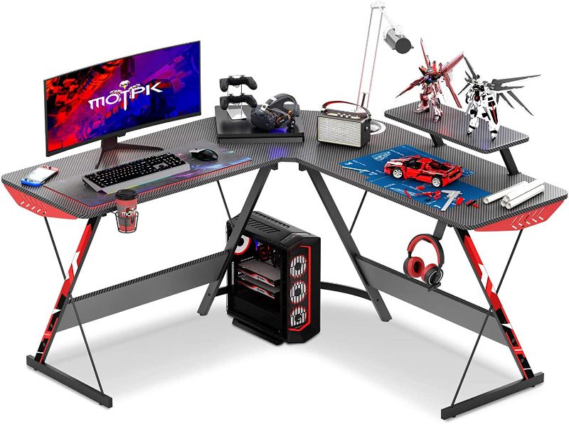 Photo 1 of MOTPK L Shaped Gaming Desk 51" L Shaped Desk, Real Carbon Fiber Coated, Gaming Desk Table with Large Monitor Riser Stand for Home Office, Sturdy Writing Workstation, Gaming Desk with Shelf, Black
