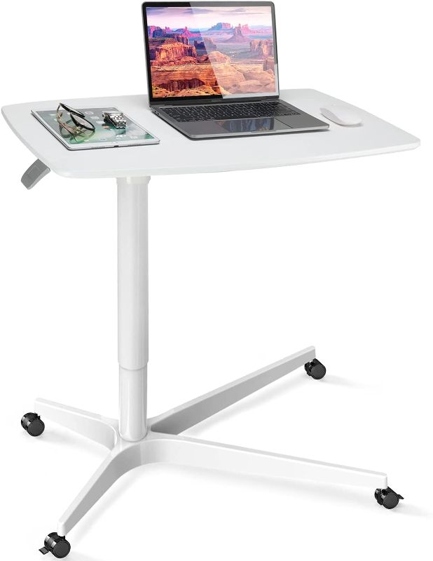 Photo 1 of Mobile Standing Desk Height Adjustable Sit to Stand Table, 30 inches Pneumatic Laptop Desk with Gas Spring Riser, Overbed Table with Wheels for Offices, Home, Medical and School by HUANUO
