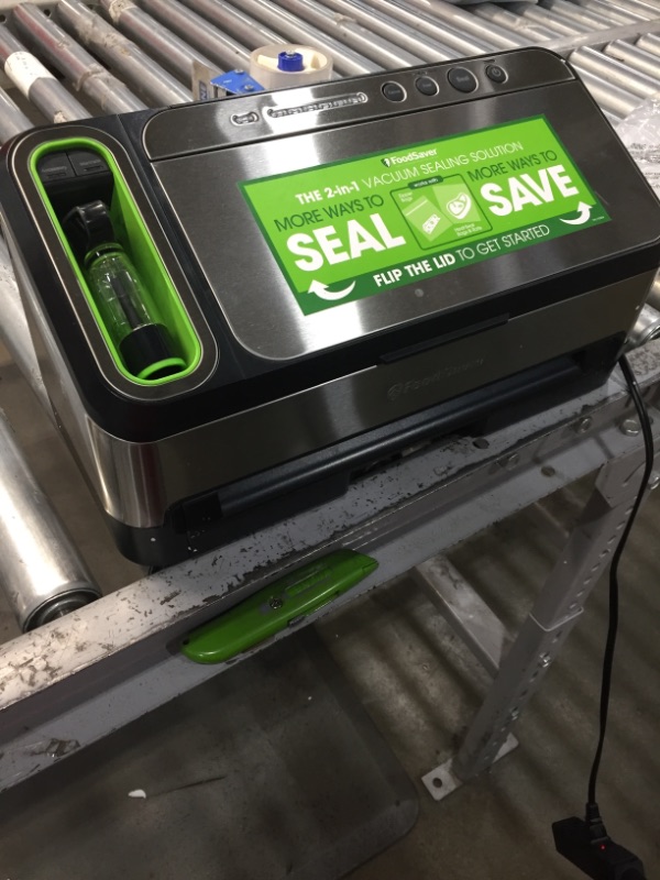 Photo 2 of *NOT FUNCTIONAL, selling for PARTS, NO RETURNS*
FoodSaver V4840 2-in-1 Vacuum Sealer Machine with Automatic Bag Detection and Starter Kit | Safety Certified | Silver, 18.80 x 9.50 x 10.60 inches
