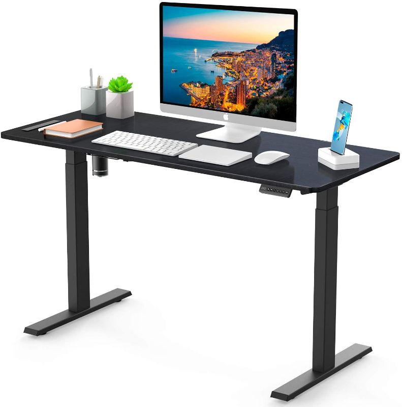 Photo 1 of Adjustable Stand Up Desk, 55x24 Inch Extra-Large Memory Electric Standing Desk, Ohuhu Height Adjustable Computer Desk with 4 Settable Memory Heights, Heavy Duty Modern Ergonomic Desks for Home Office
