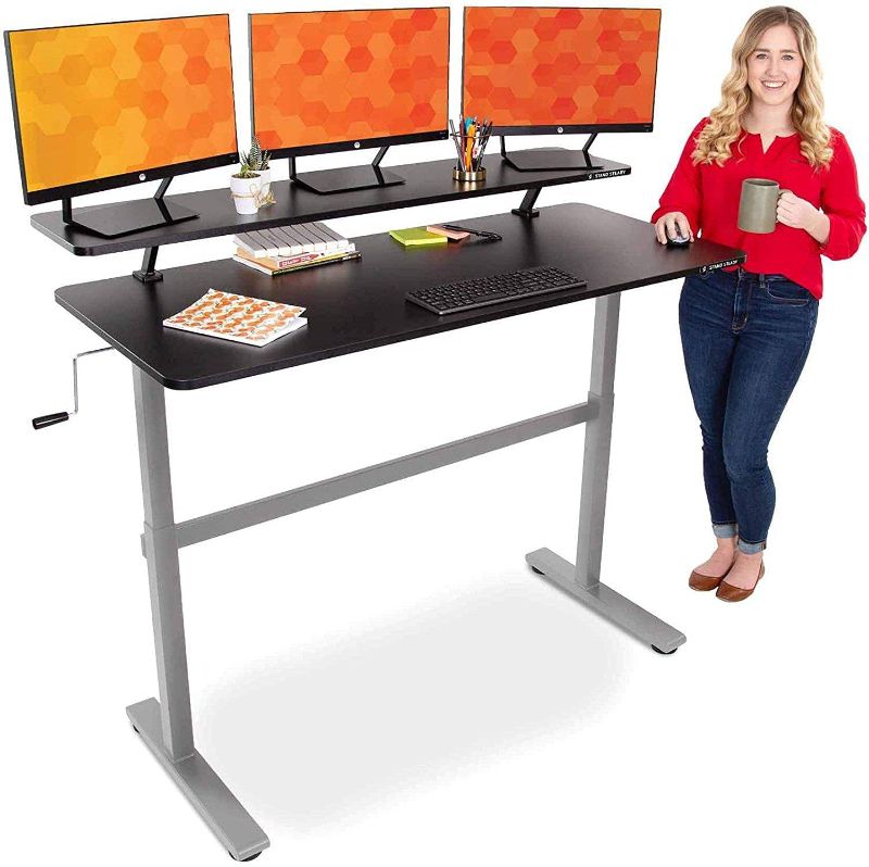 Photo 1 of Stand Steady Tranzendesk 55 in Standing Desk with Clamp On Shelf | Easy Crank Height Adjustable Stand Up Workstation w/Attachable Monitor Riser | Holds 3 Monitors & Adds Desk Space (55 /Silver Base)
