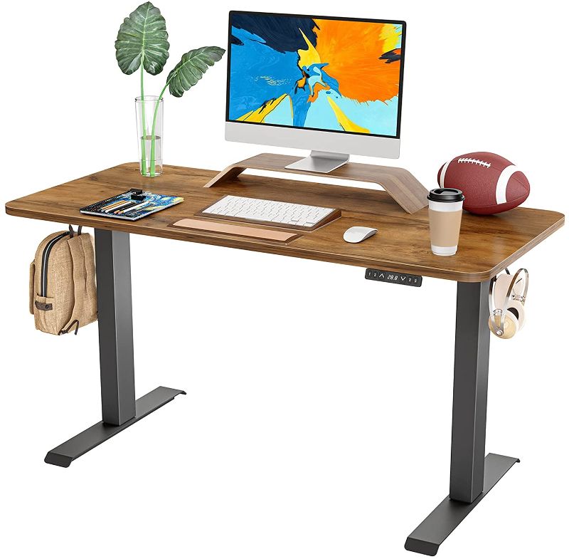 Photo 1 of FAMISKY Dual Motor Adjustable Height Electric Standing Desk, 40 x 24 Inches Stand Up Home Office Desk with Splice Tabletop, Black Frame/Walnut Top
