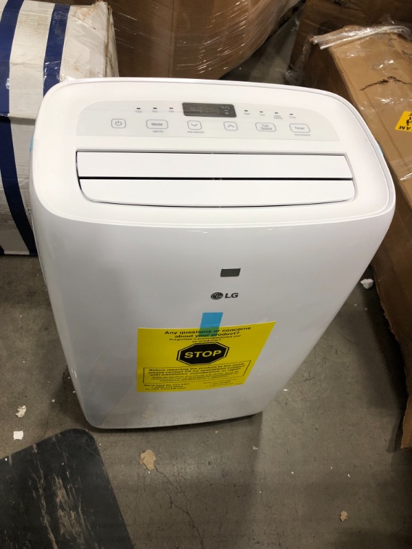 Photo 1 of 6,000 BTU (DOE) 115-Volt Portable Air Conditioner with Dehumidifier Function and LCD Remote in White