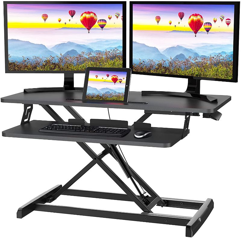 Photo 1 of Quick Sit to Stand Desktop Gas Spring Riser (Max Height:19.3inch), 33 inch Height Adjustable Standing Desk Converter for Dual Computer Monitors & Laptop Workstation, Perfect Home Office by HUANUO
