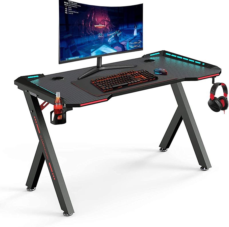 Photo 1 of TUBYIC 55 Inch Gaming Desk with Led Light,Large Home Office Desk Computer Desk Z Shaped Pc Gaming Workstation with Carbon Fiber Surface Cup Holder and Headphone Hook(Black)
