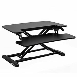 Photo 1 of FLEXISPOT Standing Desk Converter 28 Inches Stand up Desk Riser Height Adjust... See original listing
