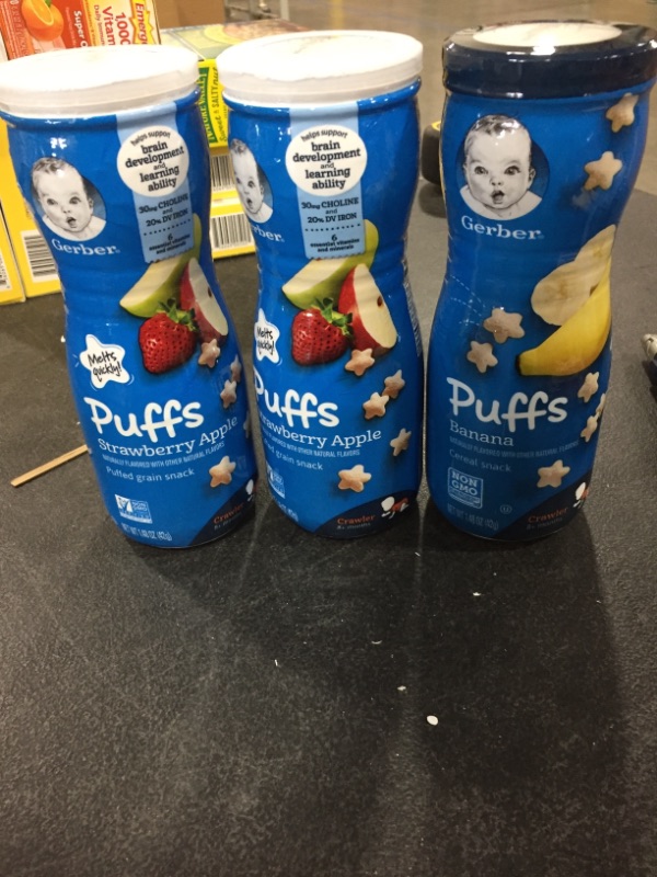 Photo 1 of Gerber Puffs Cereal Snack, Strawberry Apple, 1.48 OZ 2 COUNT EXP. APR. 09 2022 Gerber Graduates Puffs Cereal Snack, Banana, 1.48 Ounce 1 COUNT TOTAL OF 3 PACKS EXP. MAR 29 2022