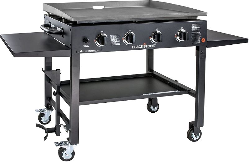 Photo 1 of Blackstone 1554 Cooking 4 Burner Flat Top Gas Grill Propane Fuelled Restaurant Grade Professional 36” Outdoor Griddle Station with Side Shelf, 36 Inch, Black
