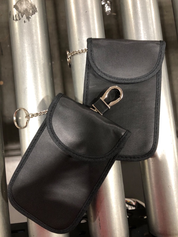 Photo 1 of Black pouch with keychain and clip