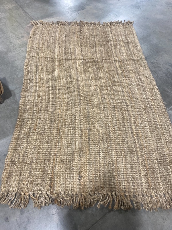 Photo 1 of 60" x 95" brown woven carpet