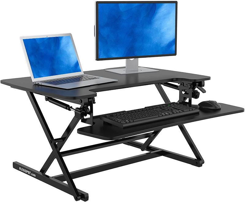 Photo 1 of FlexiSpot Standing Desk Riser- 35" Height Adjustable Desk Tabletop Computer Workstation Sit to Stand Desk Converter Gas Spring Desktop Riser with Spacious and Quick Release Keyboard Tray
