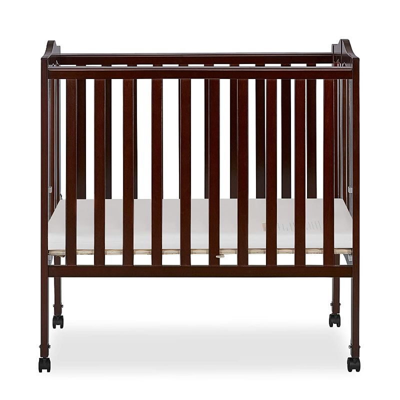 Photo 1 of Dream On Me 2-in-1 Folding Portable Mini Crib, Natural