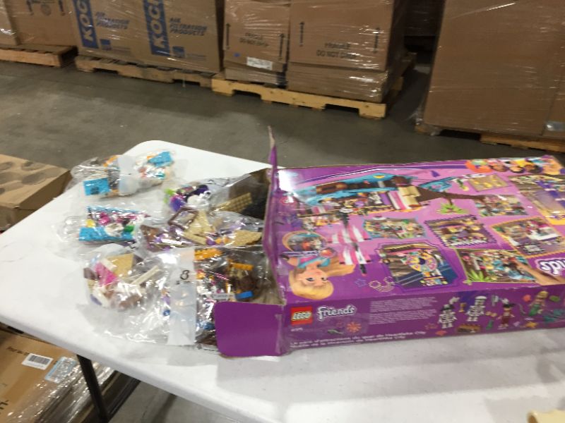 Photo 2 of LEGO Friends Heartlake City Amusement Pier 41375 Toy Rollercoaster Building Kit with Mini Dolls and Toy Dolphin, Build and Play Set Includes Toy Carousel, Ticket Kiosk and More (1,251 Pieces)
