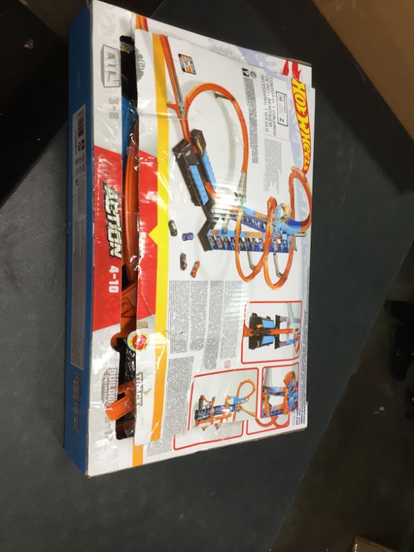 Photo 3 of Hot Wheels Sky Crash Tower Track Set, 2.5+ ft High with Motorized Booster, Orange Track & 1 Vehicle, Race Multiple Cars, Gift for Kids 5 to 10 Years Old & Up, Previously Opened,