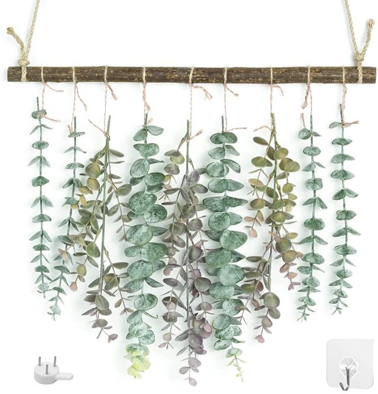 Photo 1 of Artificial Eucalyptus Greenery Hanging Wall Decor Artificial Eucalyptus Vines Wall Hanging Plants with Wooden Stick Farmhouse Rustic Boho Wall Decor for Bedroom, Living Room, Entryway and Bathroom, Tangled