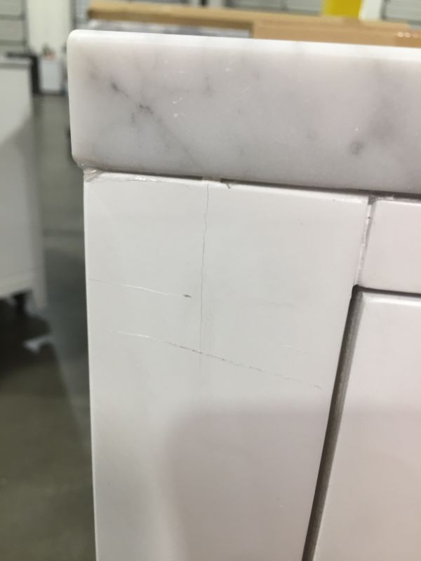 Photo 10 of Madison 30 W in. 21 L x 34 in H Vanity in Modern White with Marble Vanity Top in Carrara White, This Piece Is in Great Condition, There are 3 Minor Scratches on The Front Left Top Side, Easy Fix