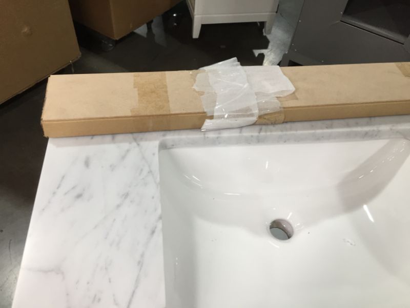 Photo 4 of Madison 30 W in. 21 L x 34 in H Vanity in Modern White with Marble Vanity Top in Carrara White, This Piece Is in Great Condition, There are 3 Minor Scratches on The Front Left Top Side, Easy Fix