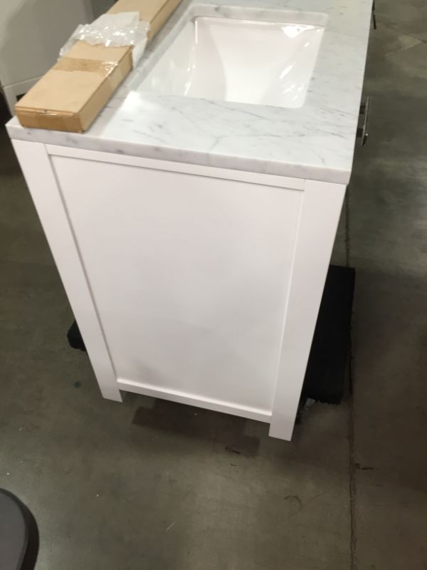 Photo 7 of Madison 30 W in. 21 L x 34 in H Vanity in Modern White with Marble Vanity Top in Carrara White, This Piece Is in Great Condition, There are 3 Minor Scratches on The Front Left Top Side, Easy Fix