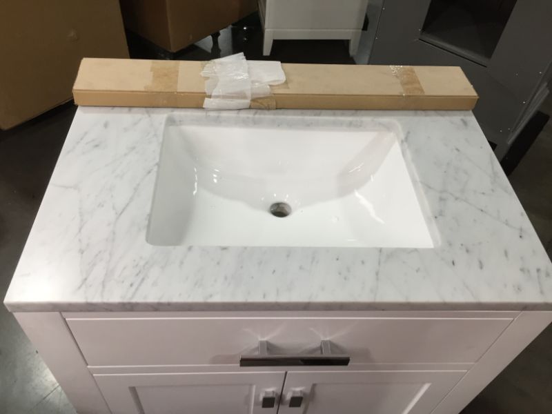 Photo 2 of Madison 30 W in. 21 L x 34 in H Vanity in Modern White with Marble Vanity Top in Carrara White, This Piece Is in Great Condition, There are 3 Minor Scratches on The Front Left Top Side, Easy Fix