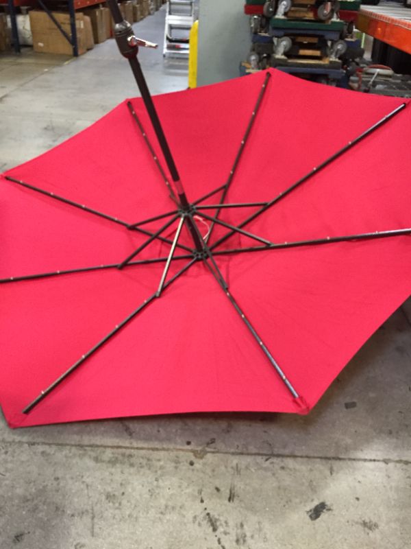 Photo 4 of Blissun 9 ft Solar Umbrella 32 LED Lighted Patio Umbrella Table Market Umbrella with Tilt and Crank Outdoor Umbrella for Garden, Deck, Backyard, Pool and Beach (Red)