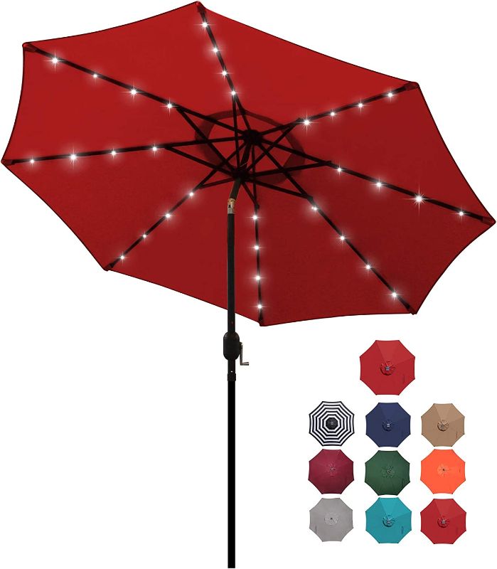 Photo 1 of Blissun 9 ft Solar Umbrella 32 LED Lighted Patio Umbrella Table Market Umbrella with Tilt and Crank Outdoor Umbrella for Garden, Deck, Backyard, Pool and Beach (Red)